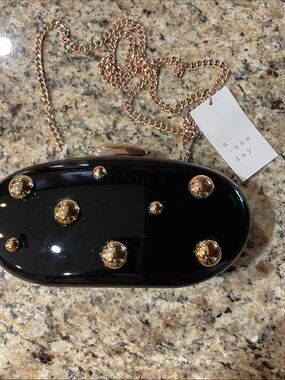 a new day Black Oval Clutch with Gold Studs and Chain Strap